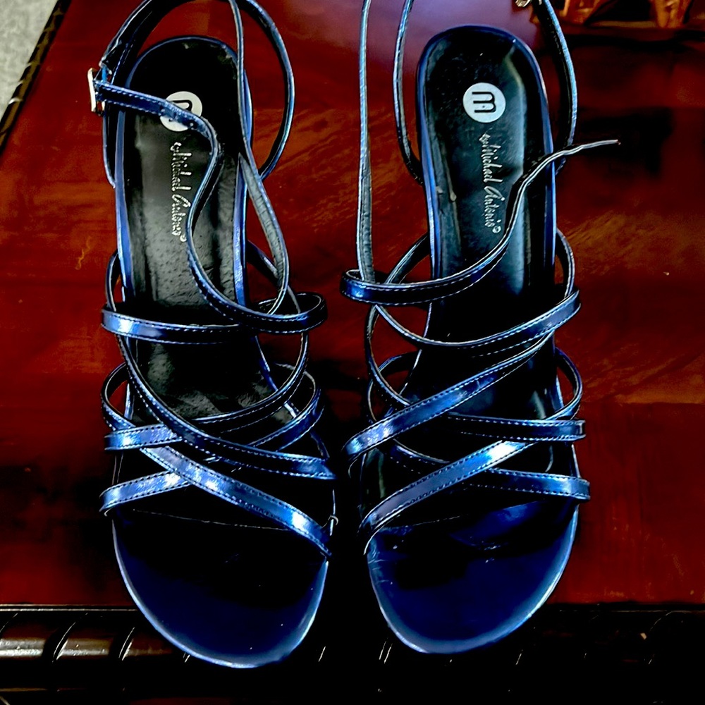 Blue strapped heel. About 4 inch heel
